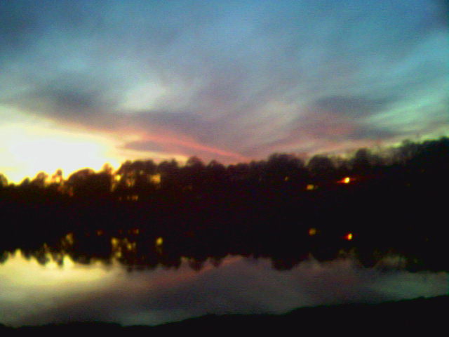 Ozark, AL: a sunset on near gunter street on a lake ozark, alabama