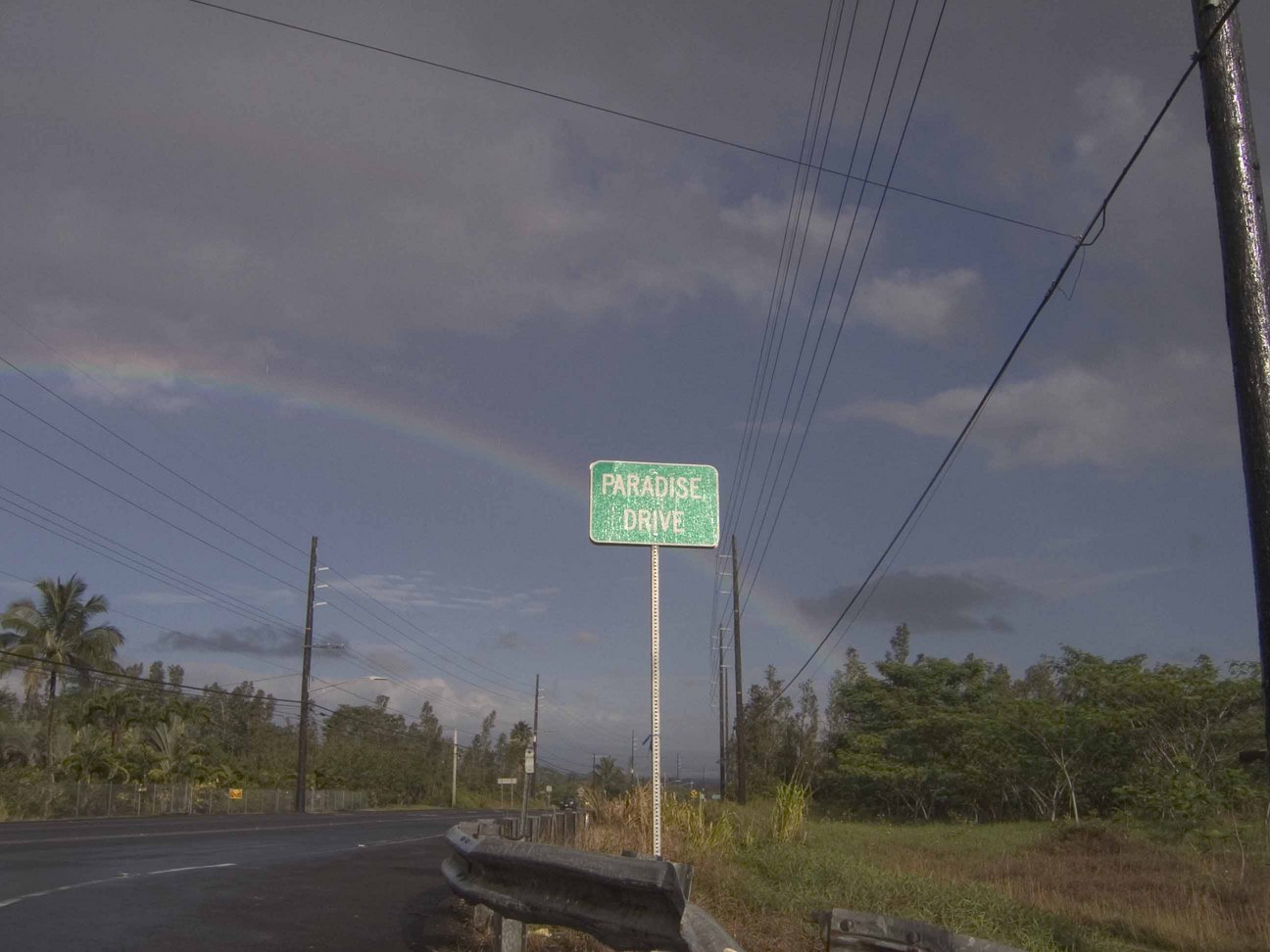 Hawaiian Paradise Park, HI : Rainbow behind the sign for Paradise Drive in Paradise Park-perfect!