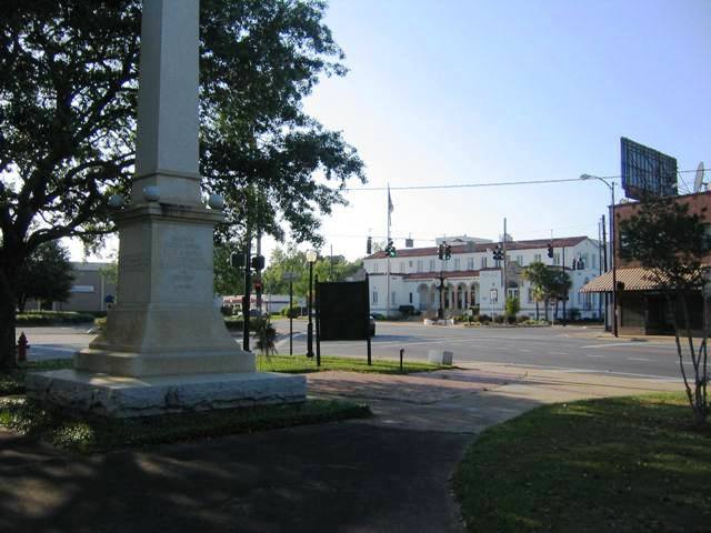 Marianna, FL: Confederate Memorial with Post Office and Town Clock in background