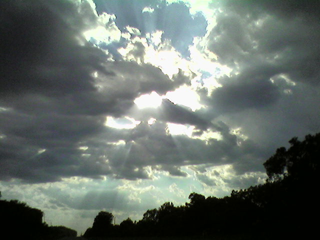 Casa, AR : Sun rays filtering through the clouds over Highway 10 in Casa