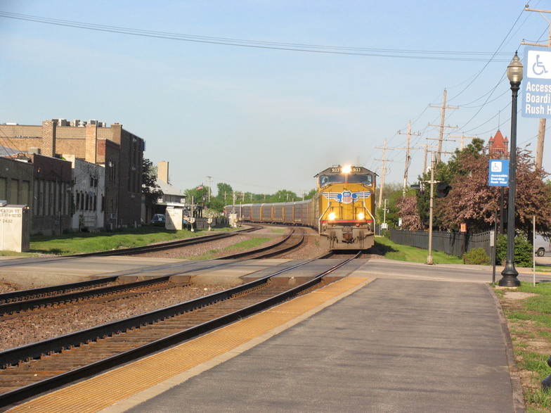Wheaton, IL: Train approaching through downtown Wheaton