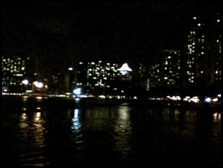 Honolulu, HI : A view of Waikiki from the end of the pier.