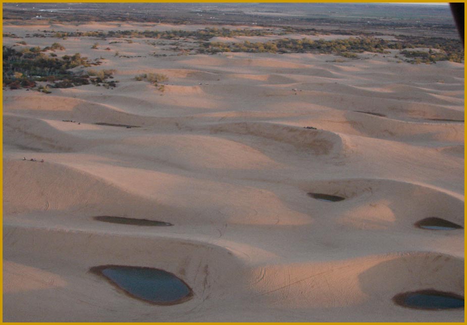 Waynoka, OK: Arial veiw of Waynoka's Little Sahara Sand Dunes with several riders a top each of the dunes.