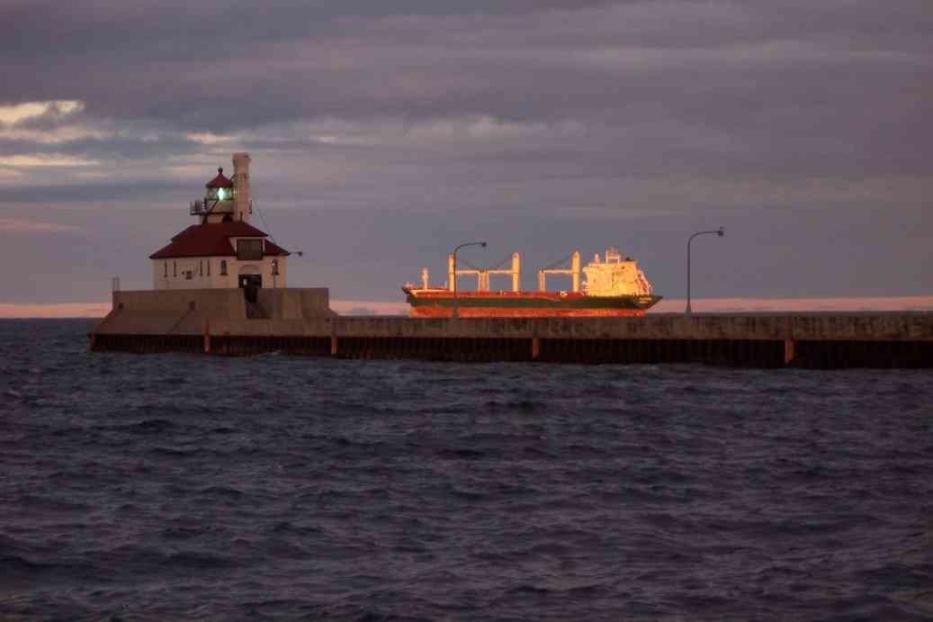Duluth, MN: Lighthouse And Ship On Lake Superior