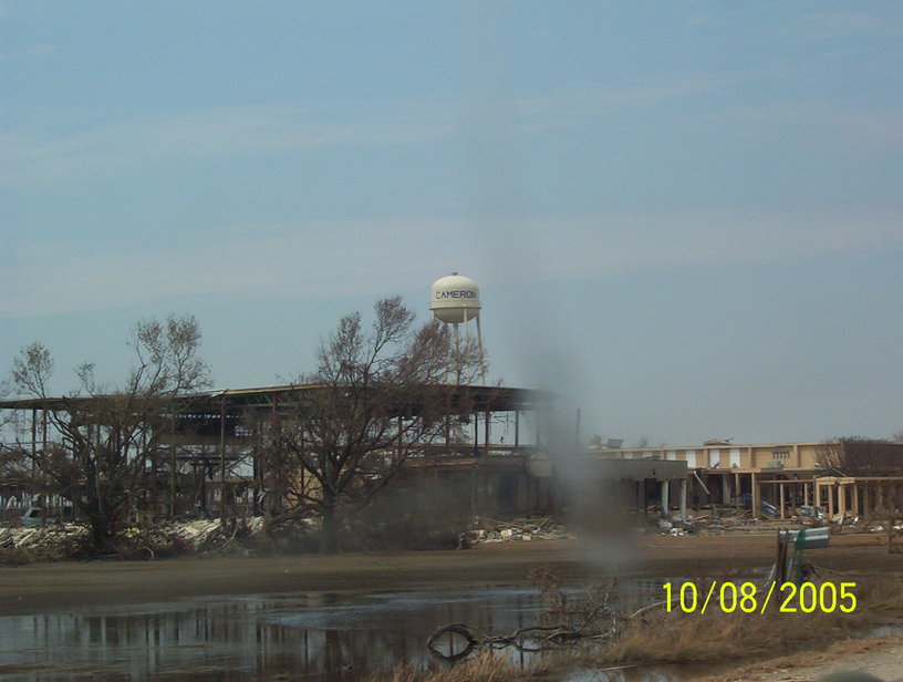 Cameron, LA : Water tower with distruction in foreground