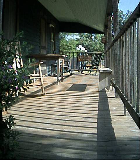 Bastrop, TX : Shadows across a lovely porch in back of a restaurant in Bastrop's historic district