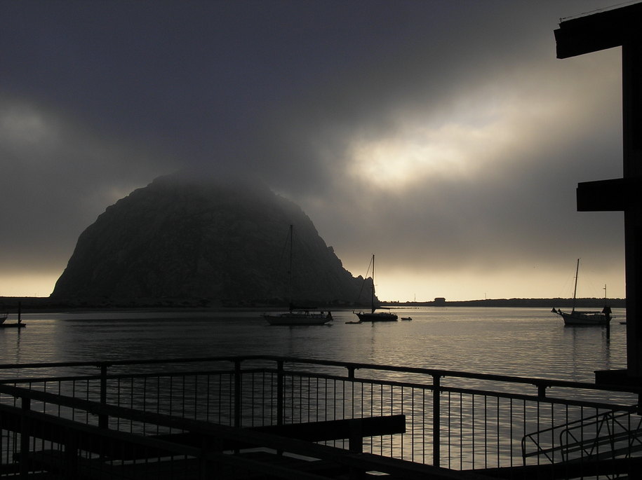 Morro Bay, CA : A Shroud Of Fog Envelops Morro Rock At Nightfall