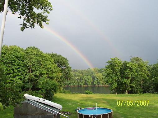 Waterville, ME: Rainbow in back yard over river at the high end of Water Street