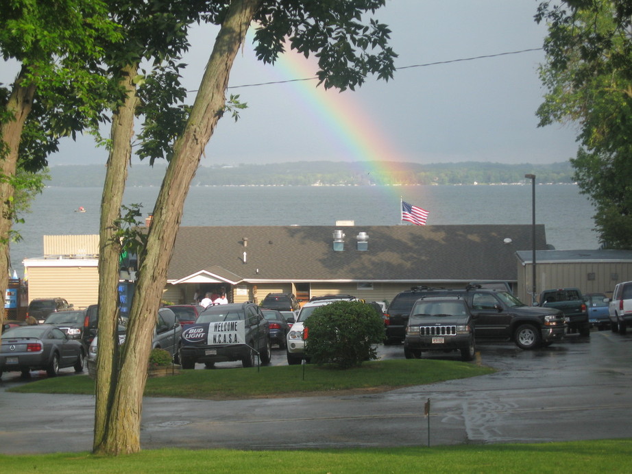 Green Lake, WI: Rainbow ending on U.S. Flag at Norton's Restaurant