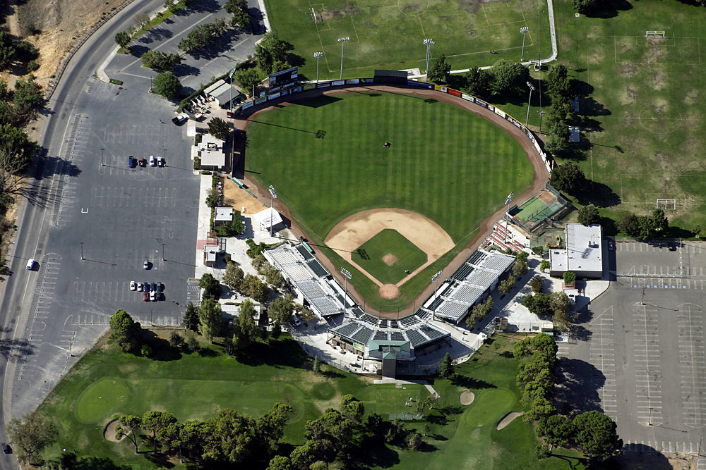 Modesto, CA: An aerial view of Fairway Park Baseball Stadium Modesto, California - note the guy mowing the grass in center field