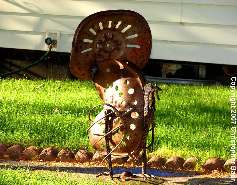 Ayrshire, IA : �We are products of our environment� and this imaginative and stylized turkey sculpture �  constructed entirely from farm cast-offs -- is a shining, (okay, rusty), example of the well-founded adage.
