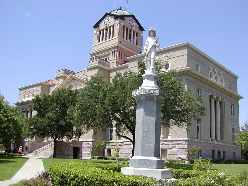 Corsicana, TX: Navarro County Courthouse.. built in 1905 in the Beaux Arts style constructed of red Burnet granite and gray brick.