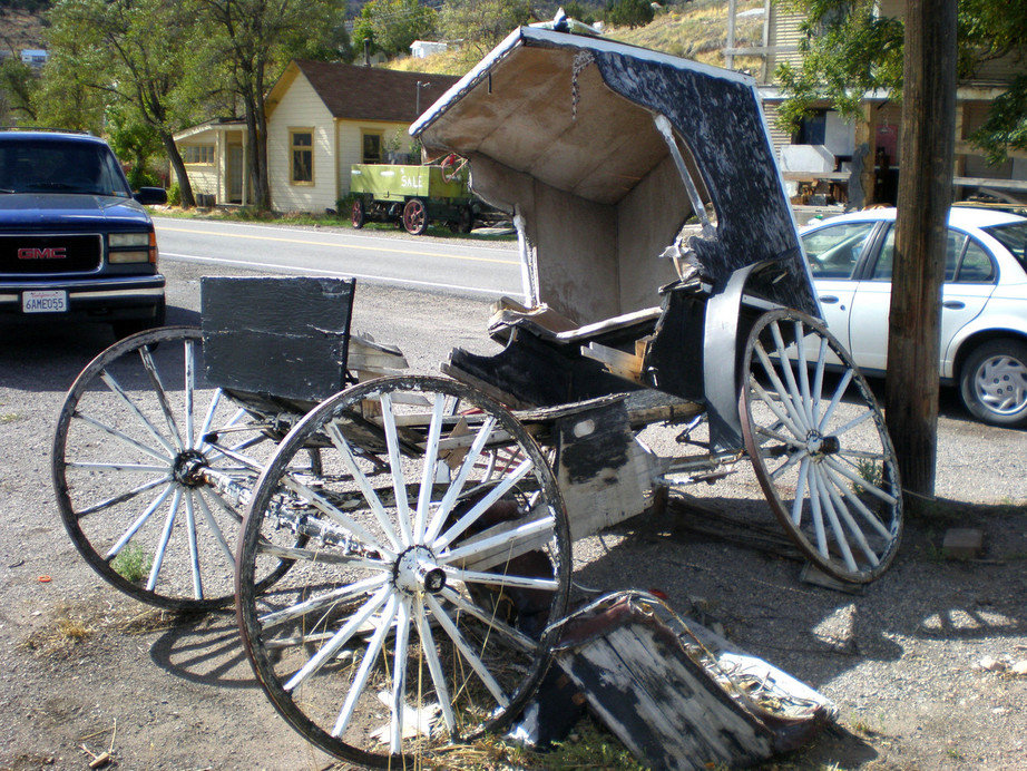 Pioche, NV : Time broken horse buggie in front of old Courthouse Pinoche
