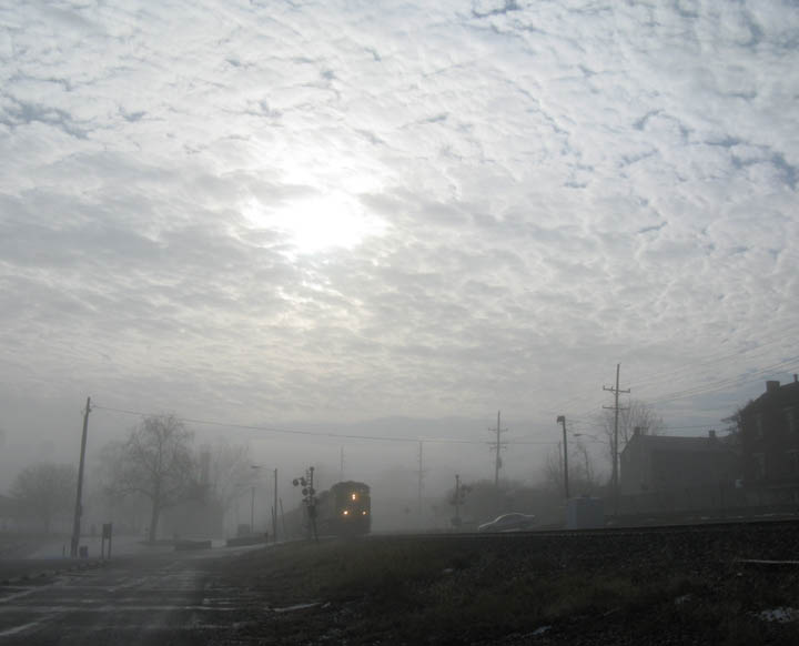Washington, MO: Train coming through town in the fog
