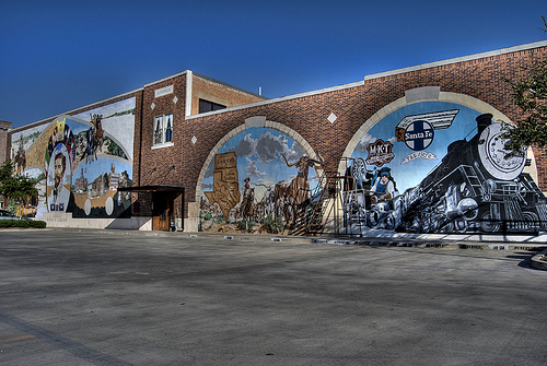 Cleburne, TX : Photo of a building wall thats being painted in downtown