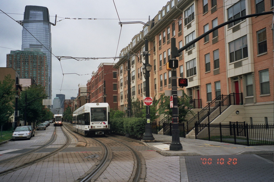 Jersey City, NJ: Light rail passing new town houses on Essex Street downtown.