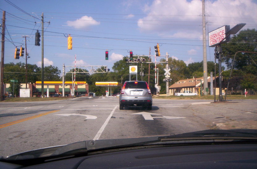 Hapeville, GA: Railroad Tracks In Hapeville, GA. Virginia Ave. And S.Central ave. N. Central Ave. is across the tracks at the Shell service station.