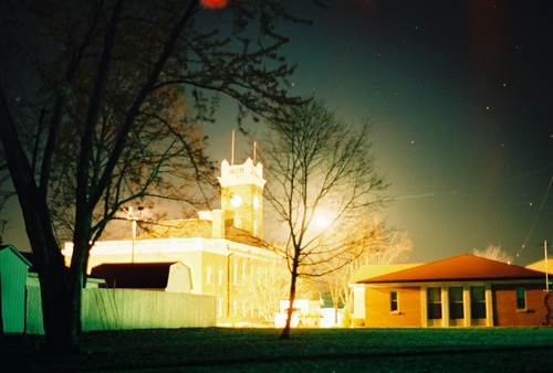 Wauseon, OH : Fulton County court house looking east with the moon shinning though the tree