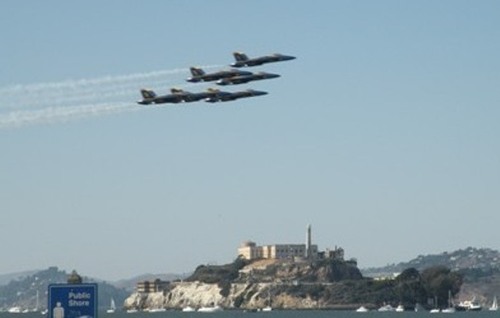 San Francisco, CA: The Blue Angels speeding past Alcatraz during Fleet Week 2008.