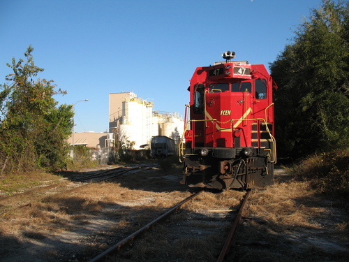 High Springs, FL: This 1956 vintage Electro-Motive diesel (FCEN 47) was seen at Prime Conduit in High Springs on November 7, 2008, on the Florida Northern Rail Road. This approximately 1.75 mile straight length of track passing through the center of High Springs is all that remains of the Atlantic Coast Line track from Alachua through High Springs and Fort White to Live Oak. Thanks to local businesses who use rail, sights like this are still with us. This stretch of line connects south to Newberry via a switch just north of the Golden Peanut Company. These fragments of the old Alachua County railroad system, as well as remaining track beds that could be re-laid, offer the opportunity for the development of a local light passenger public transport rail system that could serve the community in the years ahead and the population density and industrial, commercial, and residential development increases in the area in combination with higher fuel prices.