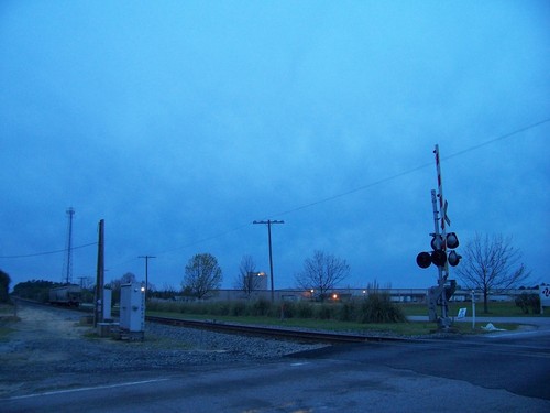 Pontiac, SC: The grade crossing of Bookman Road and the CSX tracks in Pontiac, South Carolina at dusk. The building in the background is UTI Integrated Logistics.