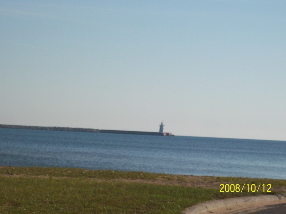 Harbor Beach, MI: Shore at Bathing Park beach with Lighthouse in background