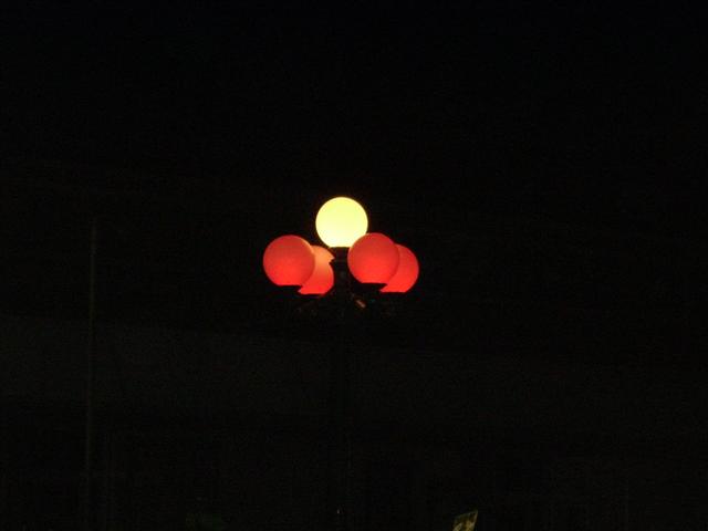 Coleman, TX : We have old fashioned lights in middle of intersection. During Christmas holiday they change the bulbs to red and green.