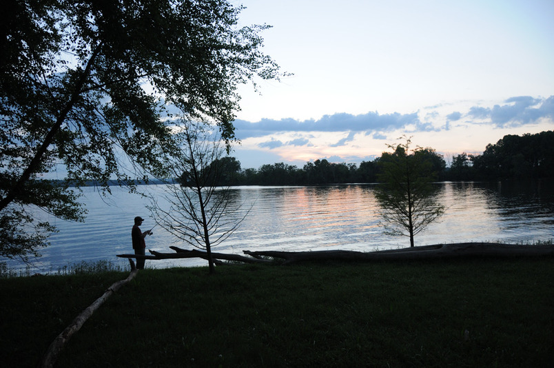 Hendersonville, TN: Man fishing at twilight on Old Hickory lake.