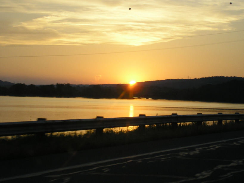 Russellville, AR: Driving across the Lake Dardanelle Bridge at Sunset