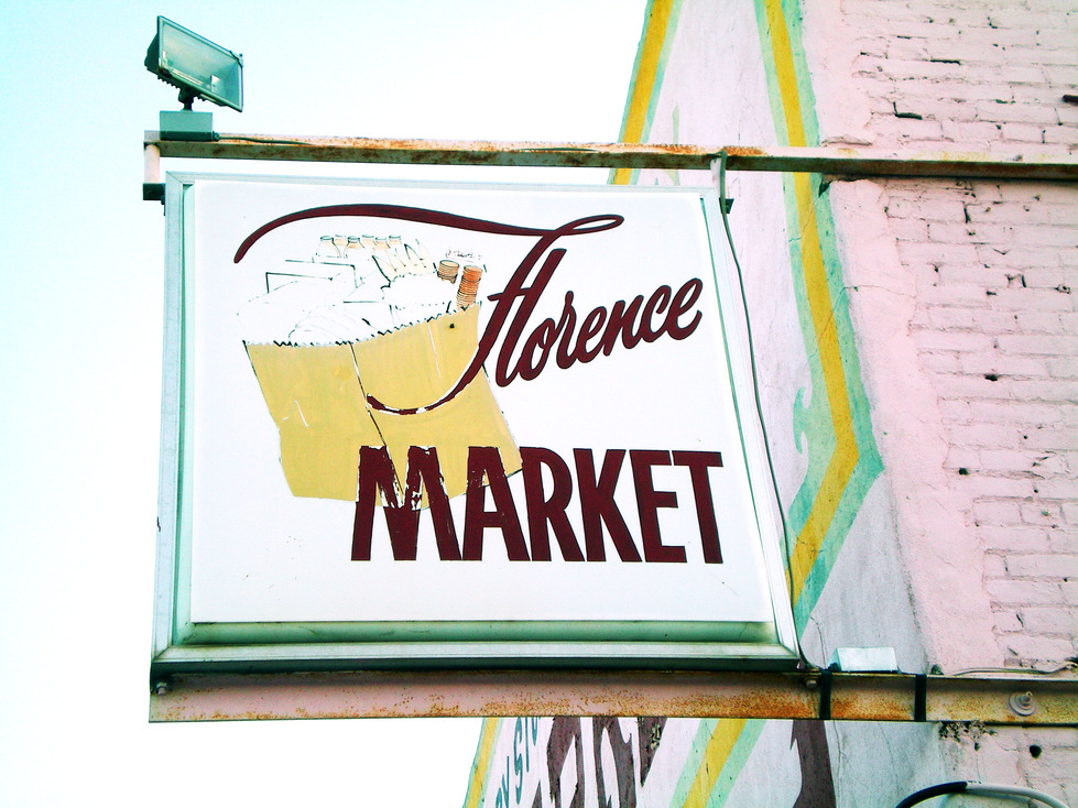 Florence, AZ: Backlit sign on the Florence Market, downtown Florence, Arizona.