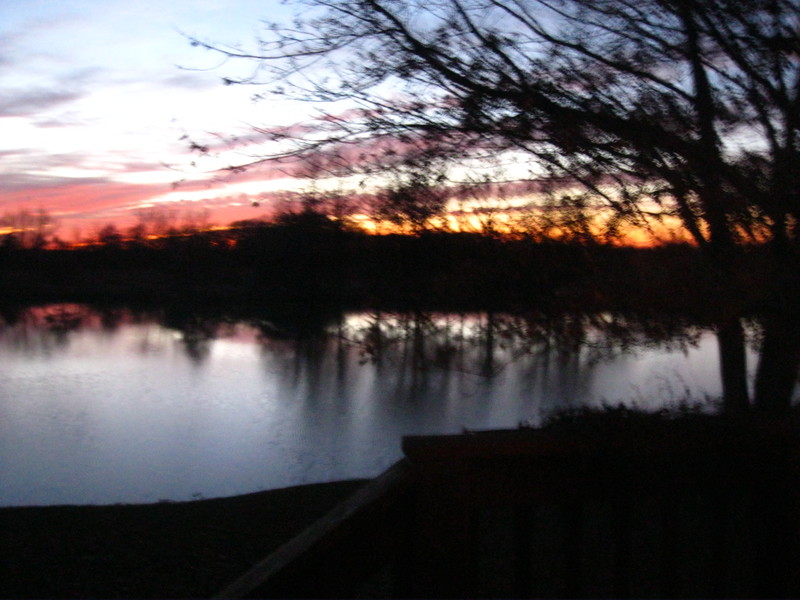 Paola, KS: A Sunset over a pond in Paola