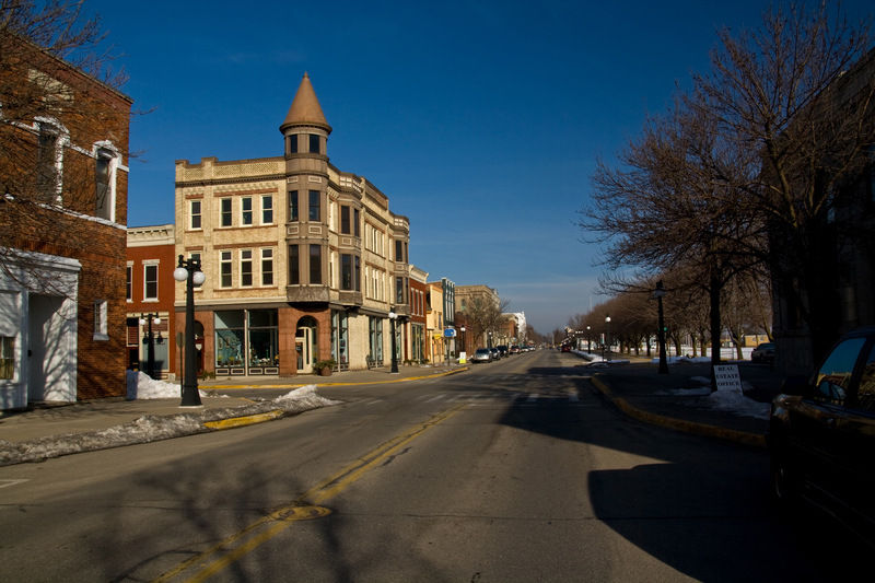 Menominee, MI: a view northward up historic 1st St during winter with clear skies