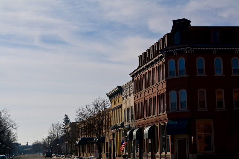 Menominee, MI: a view southward down historic 1st St during winter partly cloudy skies