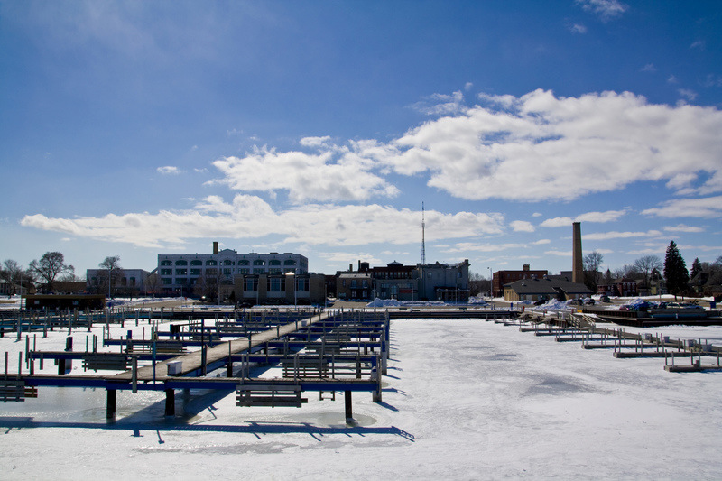 Menominee, MI: a view across the marina during winter with partly cloudy skies