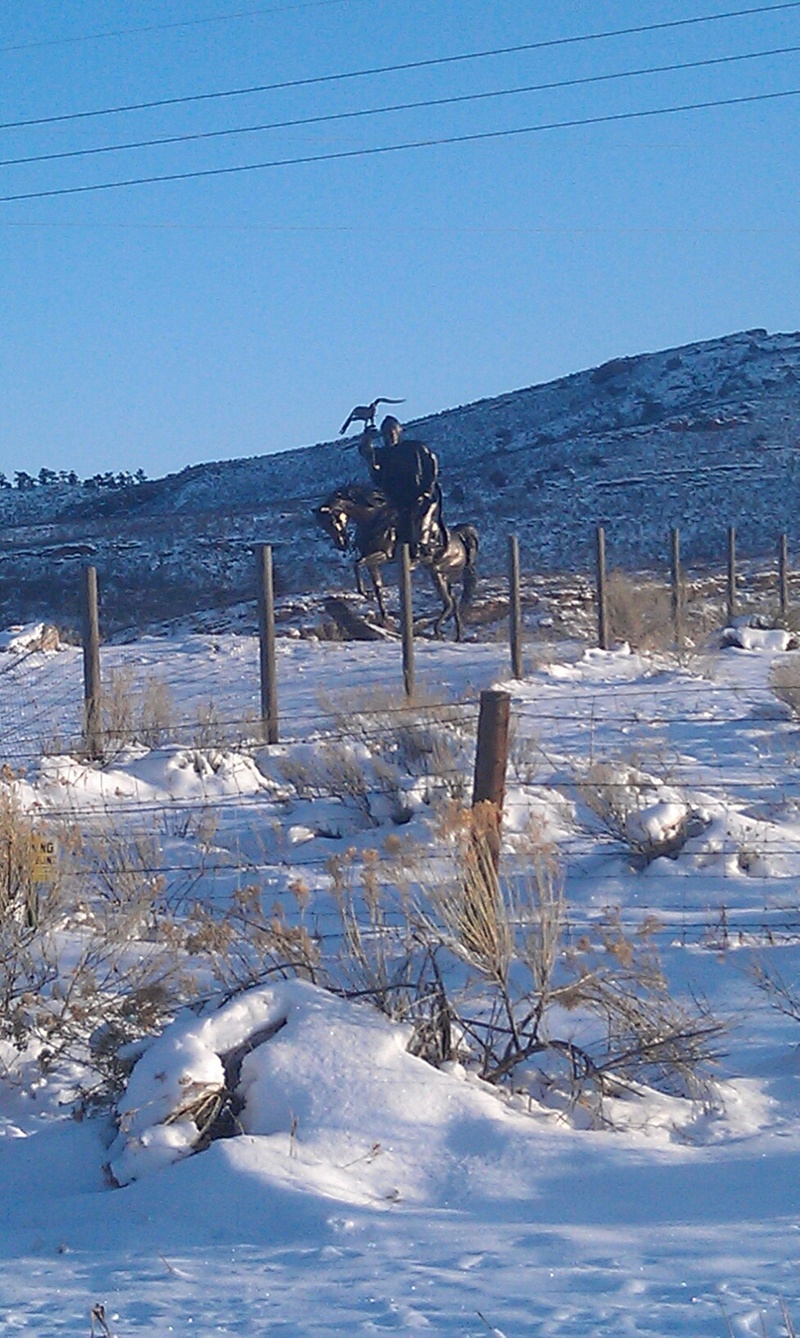 Loveland, CO: Statue of man on horse with Bird of Prey near Carter Lake