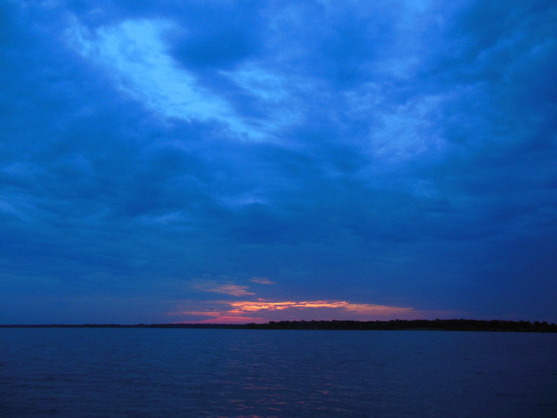 Somerville, TX: Sunset Lake Somerville with rain all around!