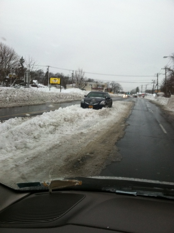 Centereach, NY: Someone else's car still stuck in middle of middle country rd Monday 2/11 after blizzard all plowed around