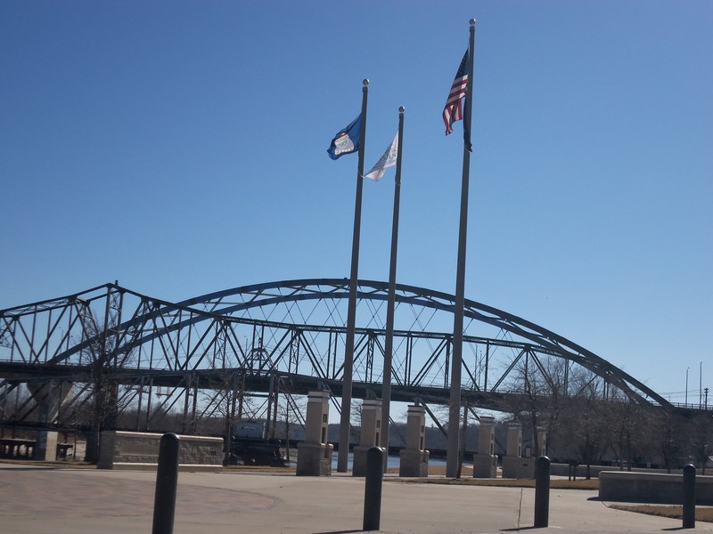 Atchison, KS: Veterans' Memorial Plaza with railroad bridge, old and new Amelia Earhart Bridge
