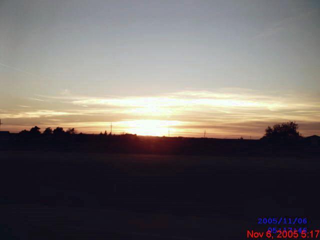 Sedgwick, KS: The setting sun over looking the bridge by the school in Sedgwick, Kansas. My small hometown.