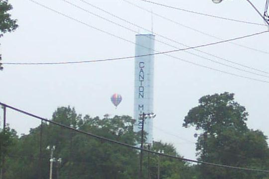 Canton, MS: Canton's historic water tank with a hot air balloon in the back ground