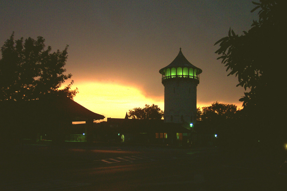 Riverside, IL: Riverside's train station and water tower on a summer night