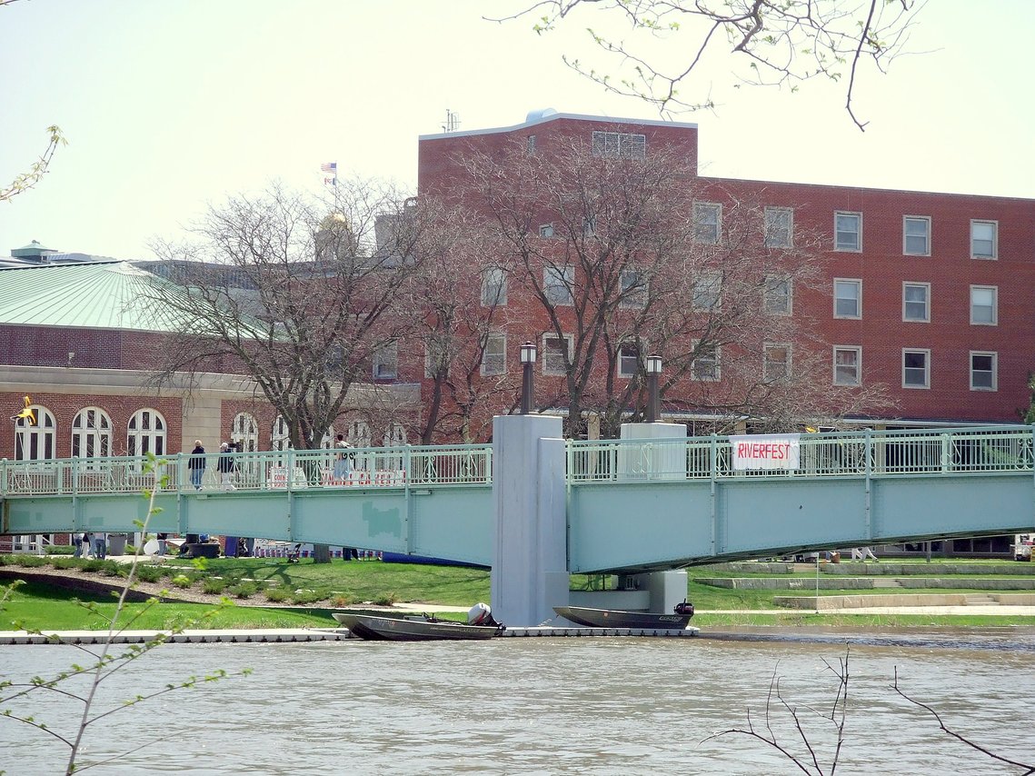Iowa City, IA: The Class of 1936 bridge across the Iowa River, with the Iowa Memorial Union in the background.