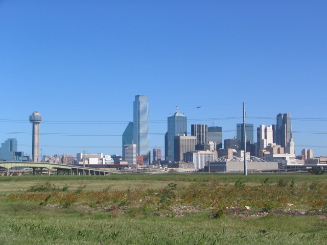 Dallas, TX: Dallas Skyline with jet flying over