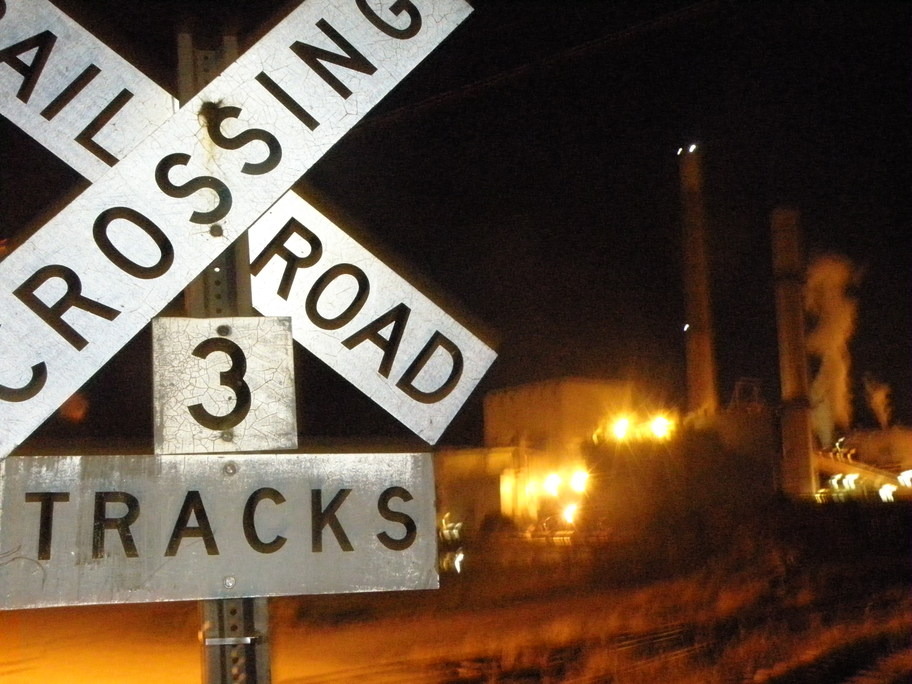 Bucksport, ME: RR crossing sign with Paper factory in the background