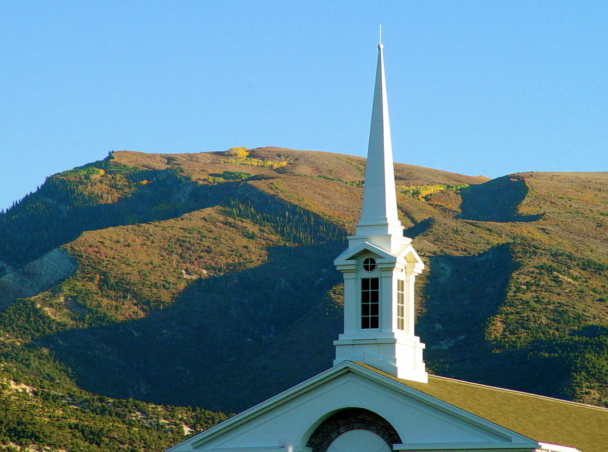 Ephraim, UT: Spire of an LDS ward house framed by peaks of the Wasatch Plateau