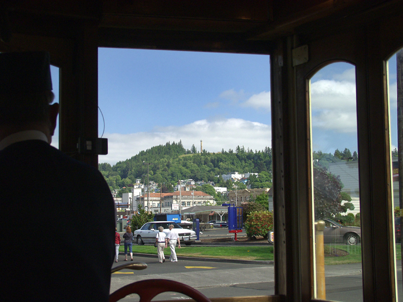 Astoria, OR : From Trolley car, Astoria Column on hill top.