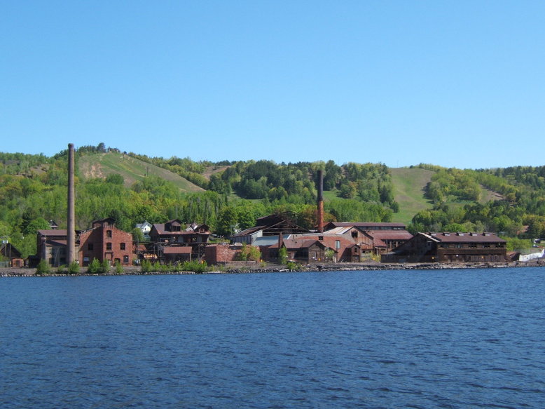 Houghton, MI: Taken from Houghton, Michigan across Portage Canal to Hancock, Michigan. Ski slopes behind abandon factory.