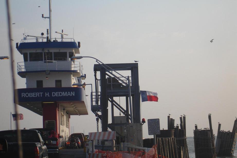 Galveston, TX: Port Bolivar-Galveston, TX Ferry, the Texas Flag, and seagulls
