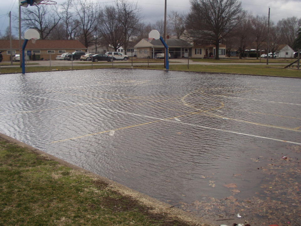 Wapello, IA: School basketball court under water after a rain storm.