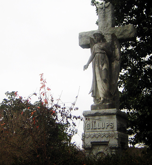 Columbus, MS: An angel perched on a headstone in Friendship Cemetery, Christmas 2005.